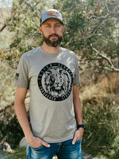 Man wearing Lion Strong t-shirt, showing the strength of the American People as they protect freedom.
